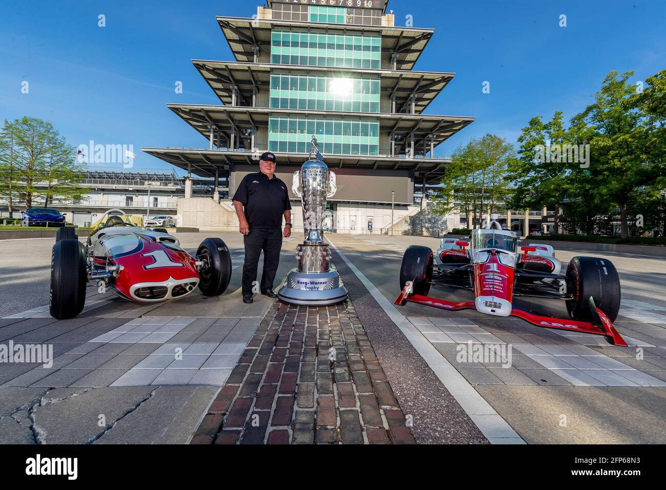 May 20, 2021, Indianapolis, Indiana, USA: 4 Time Indy500 winner, AJ Foyt, Jr poses with his 1961 winning car with the Borg Warner Trophy and his ABC Supply entry driven by JR Hildebrand. (Credit Image: © Brian Spurlock Grindstone Media/ASP via ZUMA Wire) Stock Photo