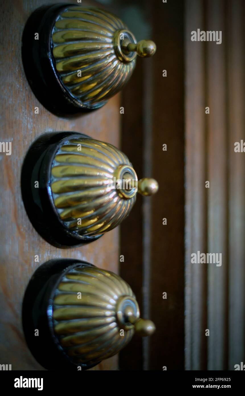 old fashioned vintage electric room light switches Stock Photo