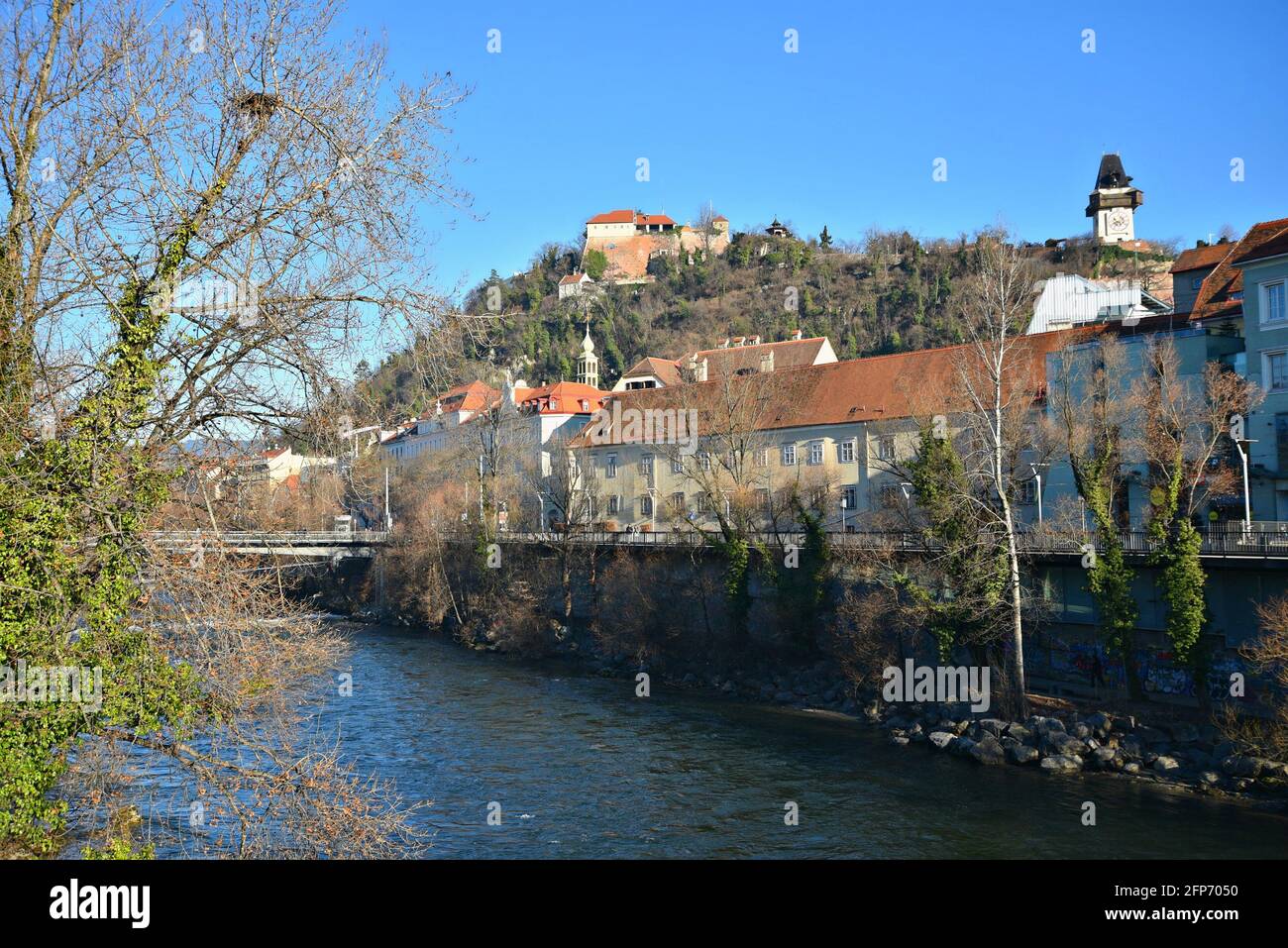 Panoramic view of Baroque style buildings on the banks of Mur river ...