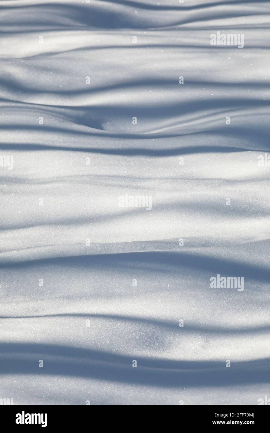 Shadows cast across snow drifts Stock Photo - Alamy