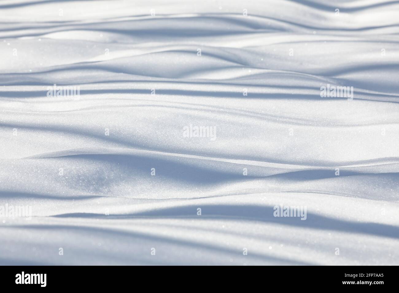 Shadows cast across snow drifts Stock Photo - Alamy