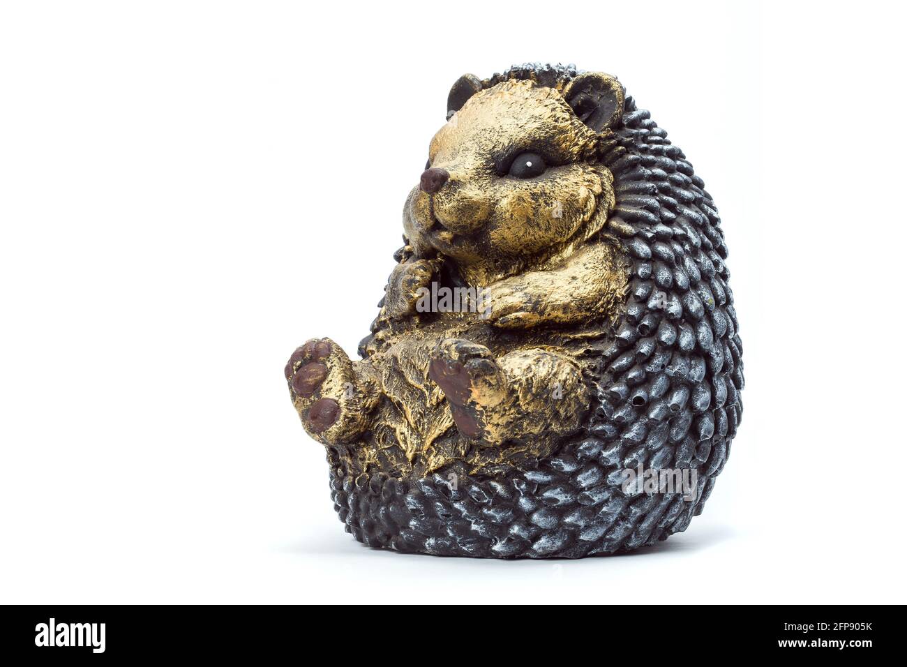 concrete garden sculpture for landscaping and backyard decoration, isolated hedgehog on a white background, nobody. Stock Photo