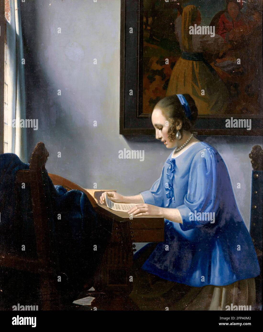 Han van Meegeren.  Muzieklezende Vrouw (Woman Reading Music), a painting in the style of Vermeer by the famous Dutch art forger, Henricus Antonius 'Han' van Meegeren (1889-1947), oil on canvas, 1935-1940 Stock Photo