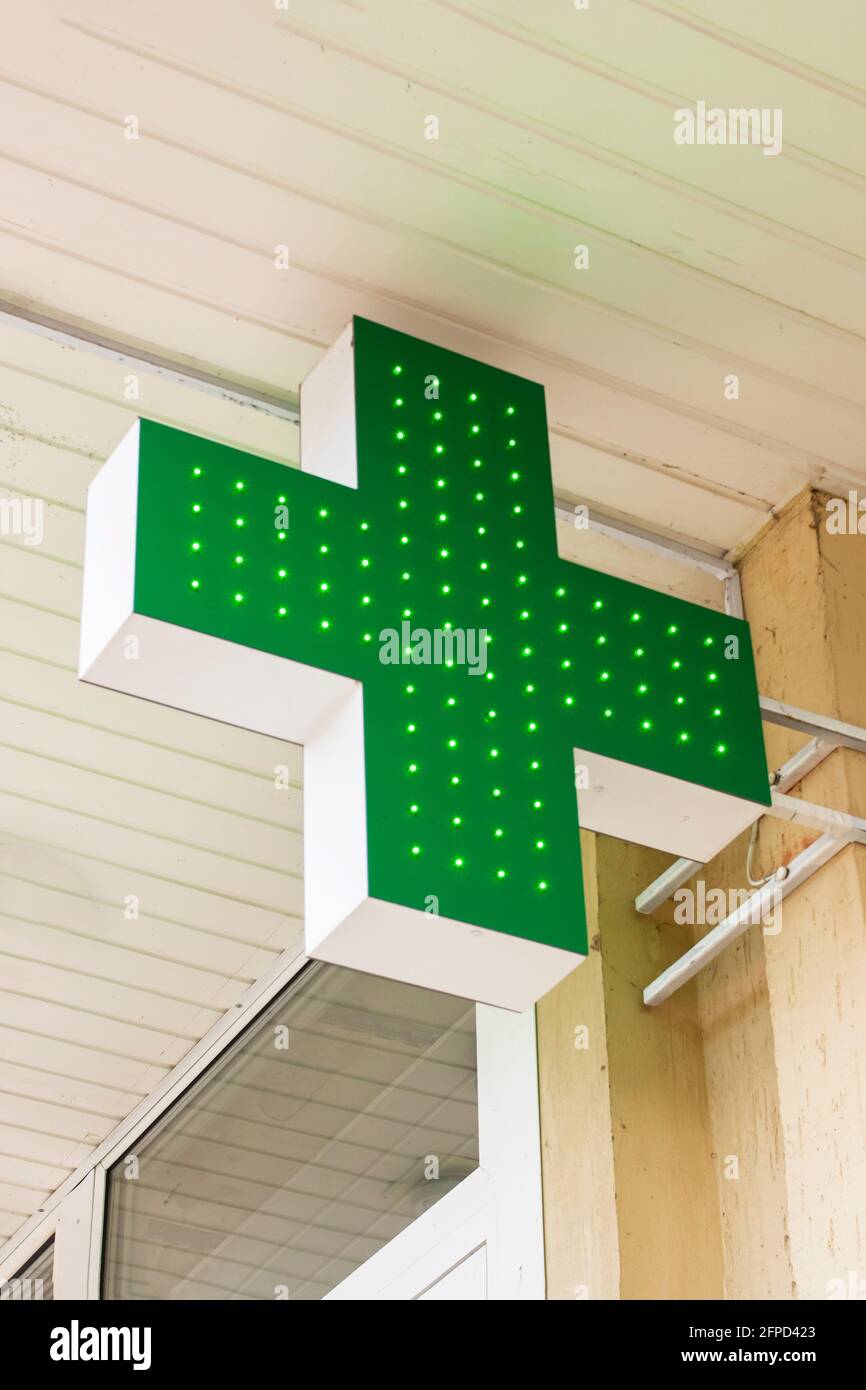 Green cross of pharmacy on wall of building Stock Photo Alamy