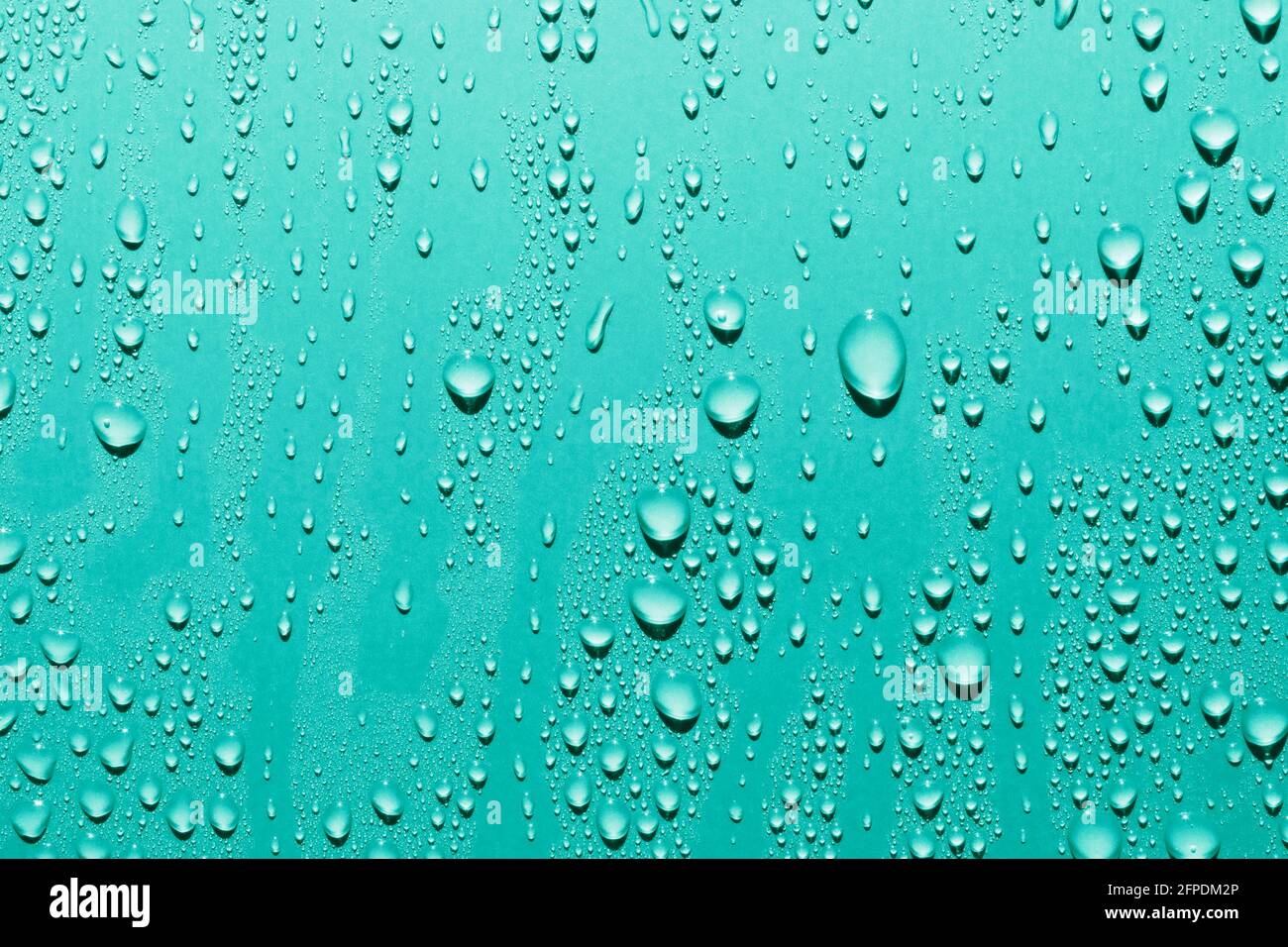Close up of water drops on smooth surface, blue background Stock Photo ...