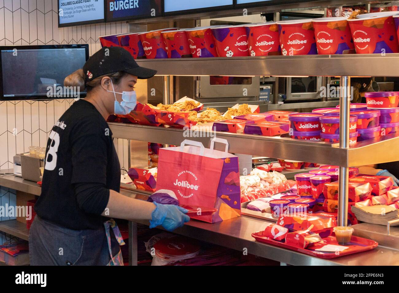 20 May 2021. London, UK. Staff prepare food orders for customers at the