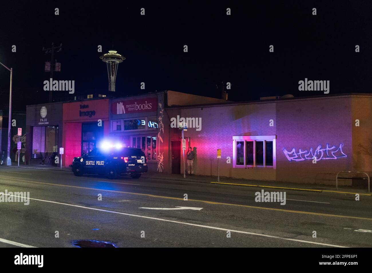 Seattle, USA. 18th Apr, 2021. Seattle Police assisting the Seattle Fire Department responding to a structure fire at Pesos restaurant in Lower Queen A Stock Photo