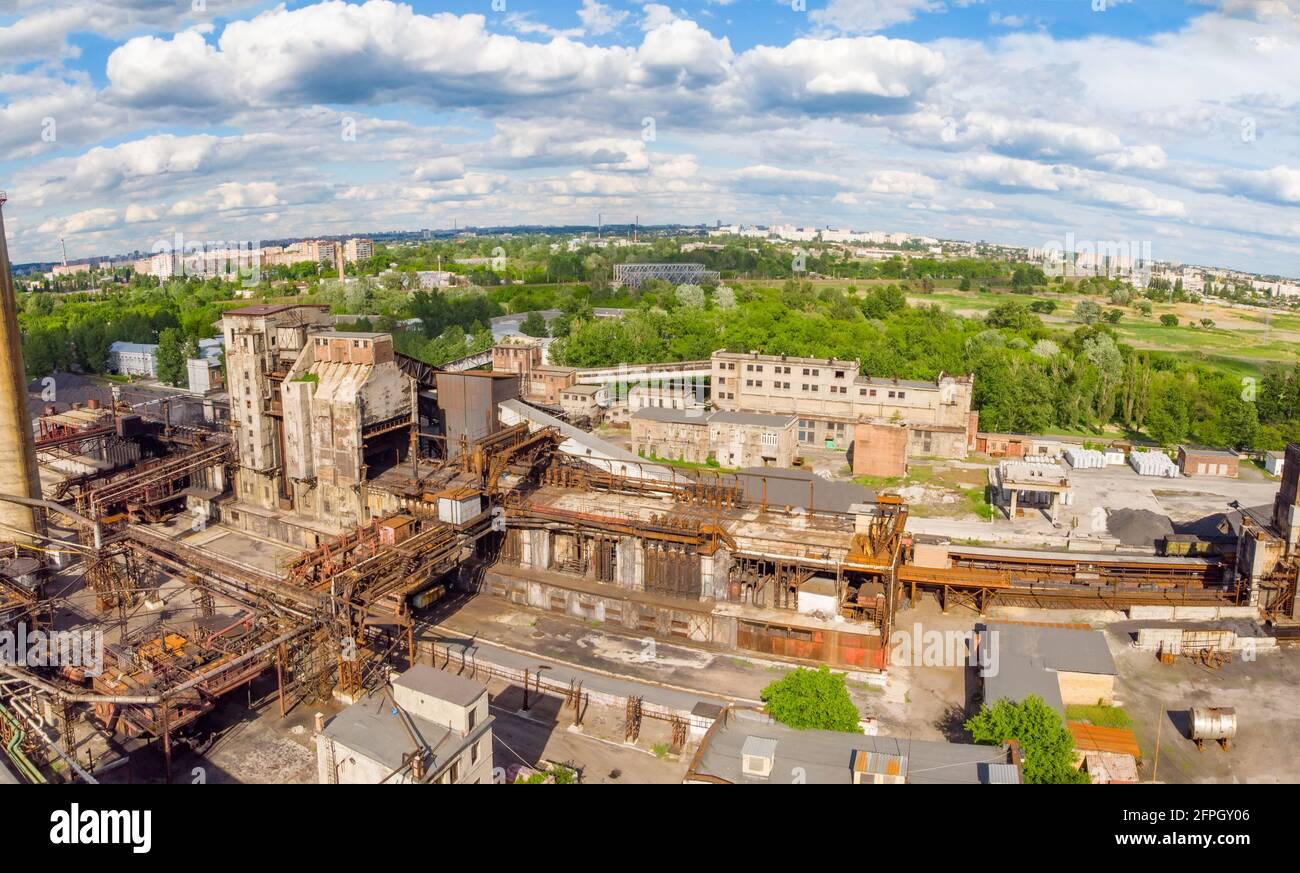 Aerial drone shot of old industrial zone with smoke stack. Air pollution concept Stock Photo