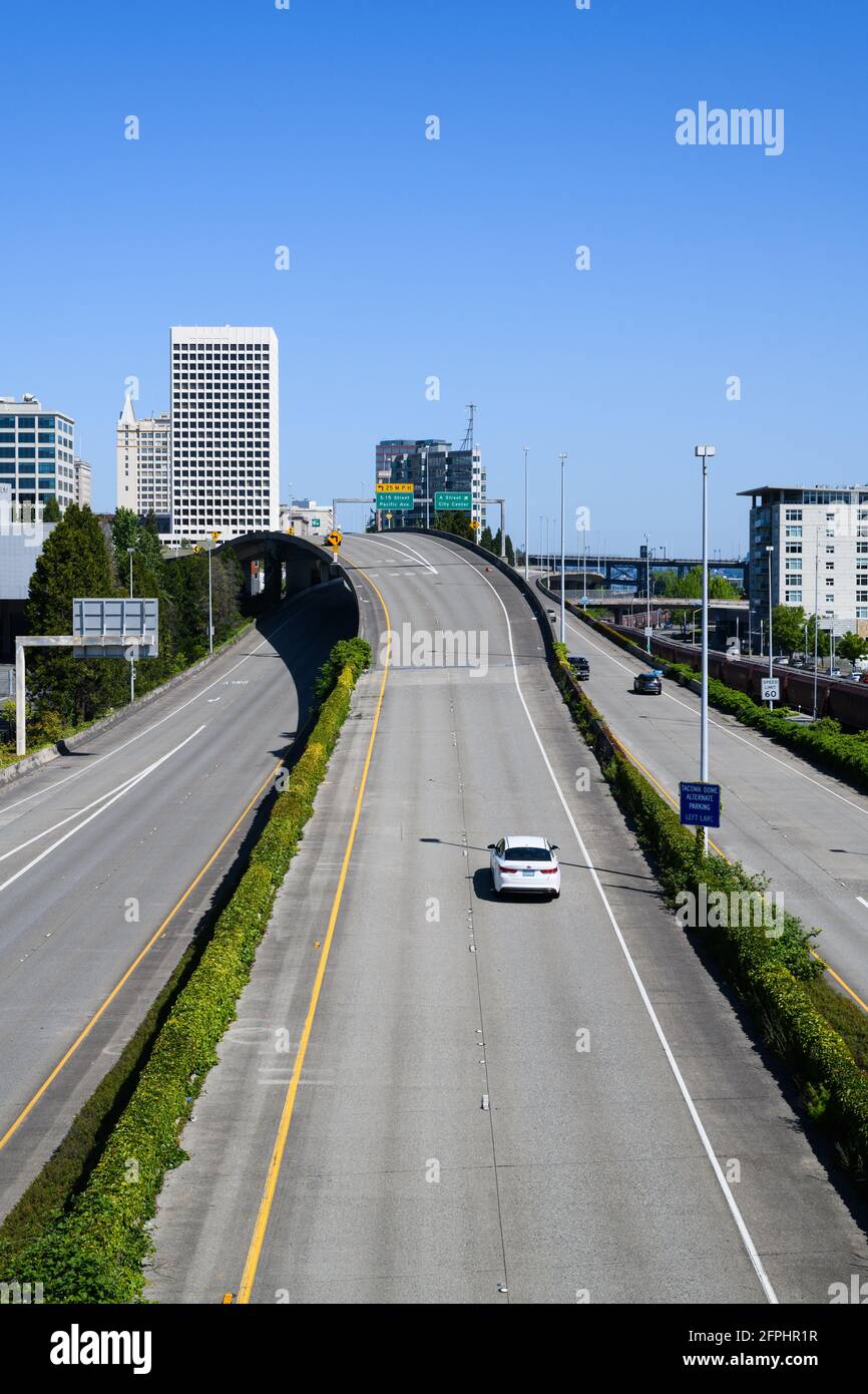 Tacoma, WA, USA - May 16, 2021; Single car exits from Interstate 705 in Tacoma to Pacific Avenue.  This is a short freeway connecting to Interstate 5 Stock Photo