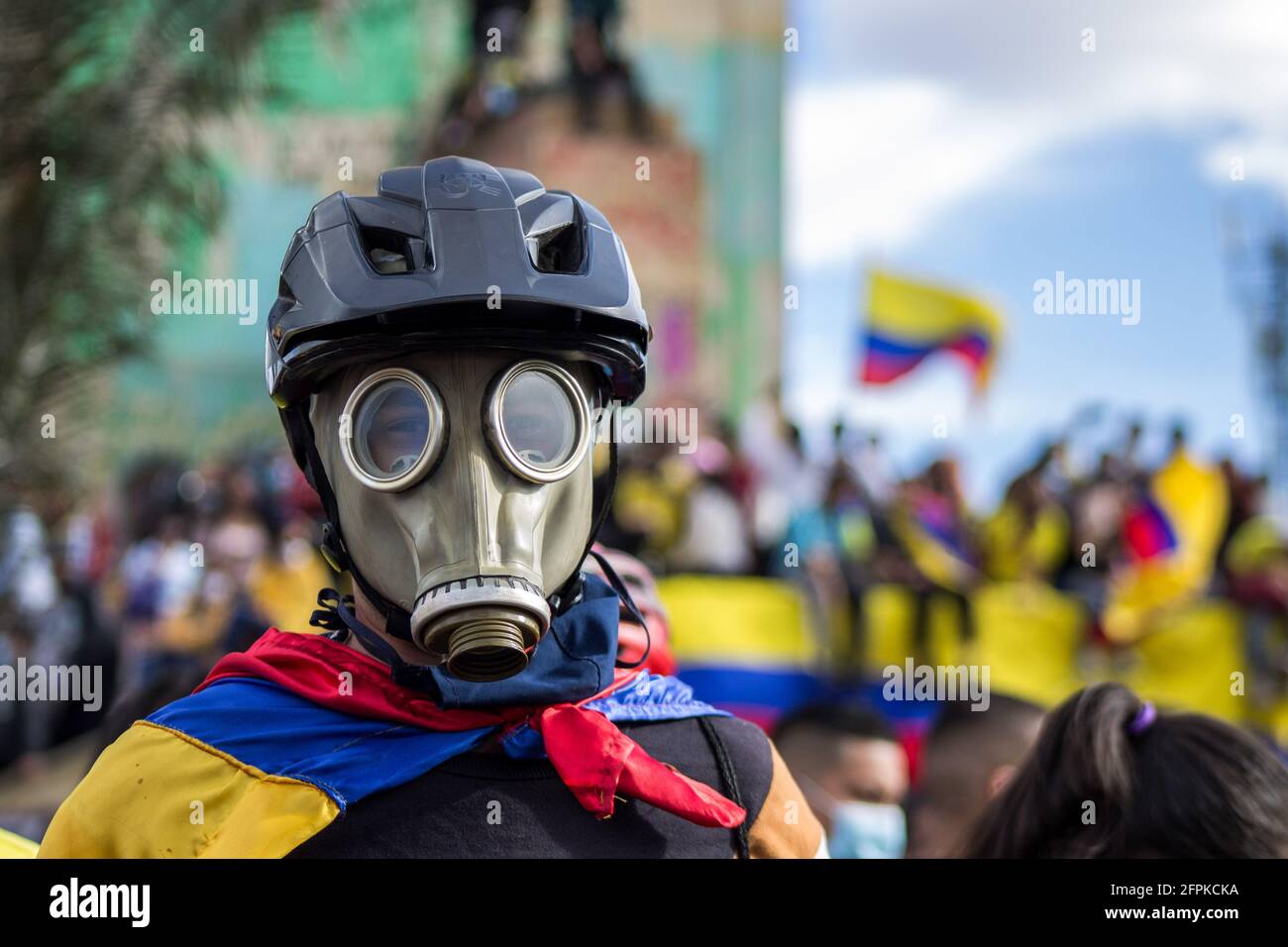 A protester wearing a gas mask takes part in the 19th of May national strike. in Bogotá.Plaza de Los Heroes (Heroes square) in Bogotá, was one of the 40 points of demonstration during the 19th of May national strike. A total of fifteen thousand people took part in the strike, on the 22nd day of protest. The protests in different parts of the country began to oppose tax reform. Police have responded with extreme violence, and the demands have multiplied as the economic crisis sharpen. (Photo by Antonio Cascio/SOPA Images/Sipa USA) Stock Photo