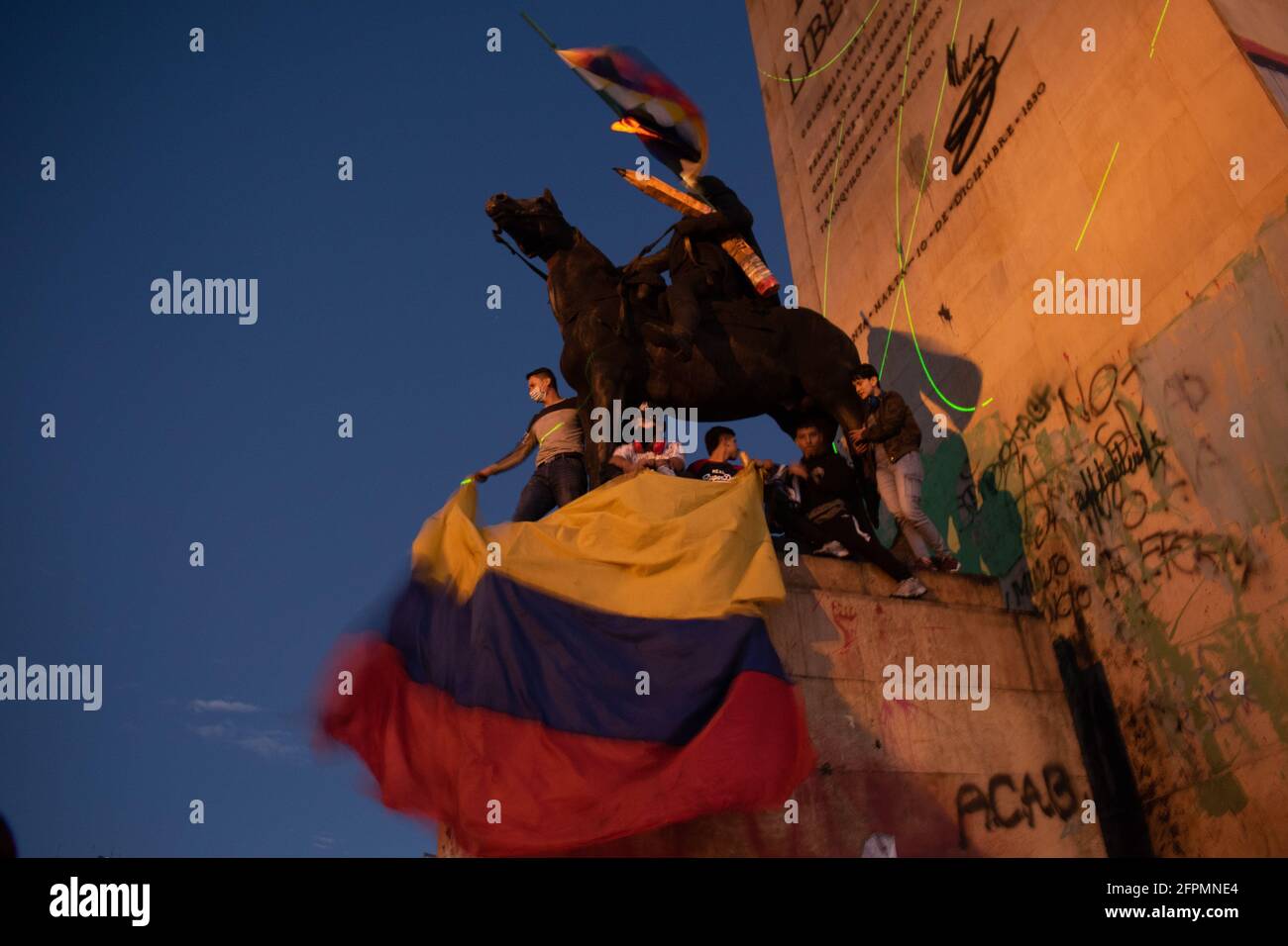 Bogota, Cundinamarca, Colombia. 19th May, 2021. Protester waves the Colombian flag as protests increase in BogotÃ¡ on May 20, 2021 in the context of a national strike in Colombia against the tax reform and the government of IvÃ¡n Duque. Credit: Daniel Romero/LongVisual/ZUMA Wire/Alamy Live News Stock Photo