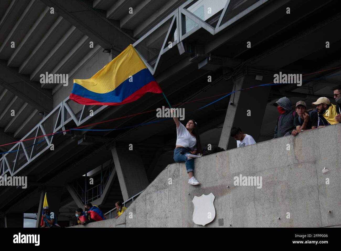 Bogota, Cundinamarca, Colombia. 19th May, 2021. Protester waves the Colombian flag as protests increase in BogotÃ¡ on May 20, 2021 in the context of a national strike in Colombia against the tax reform and the government of IvÃ¡n Duque. Credit: Daniel Romero/LongVisual/ZUMA Wire/Alamy Live News Stock Photo
