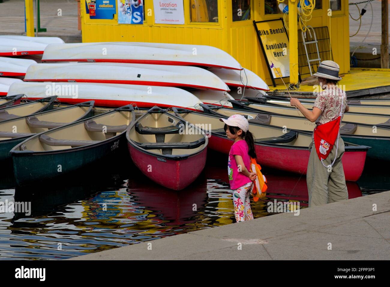 Mother and daughter fishing by the boat rental kiosk at Dow's Lake