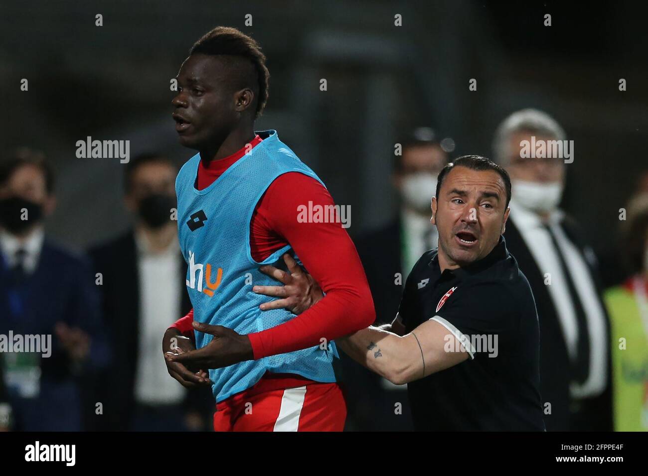 Monza, Italy 20th May 2021. Mario Balotelli of AC Monza is pushed back towards the bench by Cristian Brocchi AC Monza Head coach after the referee ordered players away from the field of play during the Serie B match at U-Power Stadium, Monza. Picture credit should read: Jonathan Moscrop/Sportimage Credit: Sportimage/Alamy Live News Stock Photo