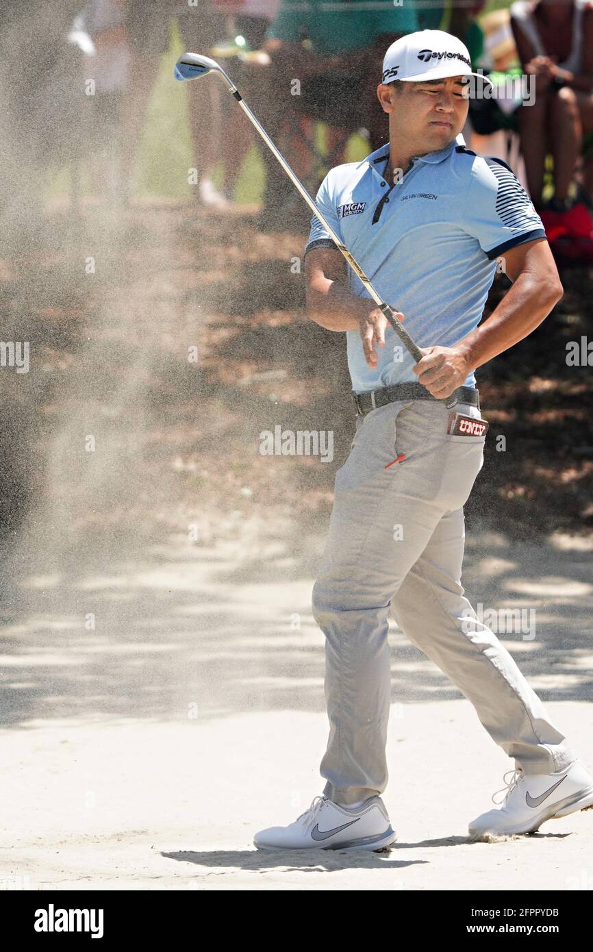 Kiawah Island, United States. 20th May, 2021. Kurt Kitayama reacts as sand blows back into his face after hitting a bunker shot on the 8th hole in the first round at the 103rd PGA Championship at Kiawah Island Golf Resort Ocean Course on Kiawah Island, South Carolina on Thursday, May 20, 2021. Photo by Richard Ellis/UPI Credit: UPI/Alamy Live News Stock Photo