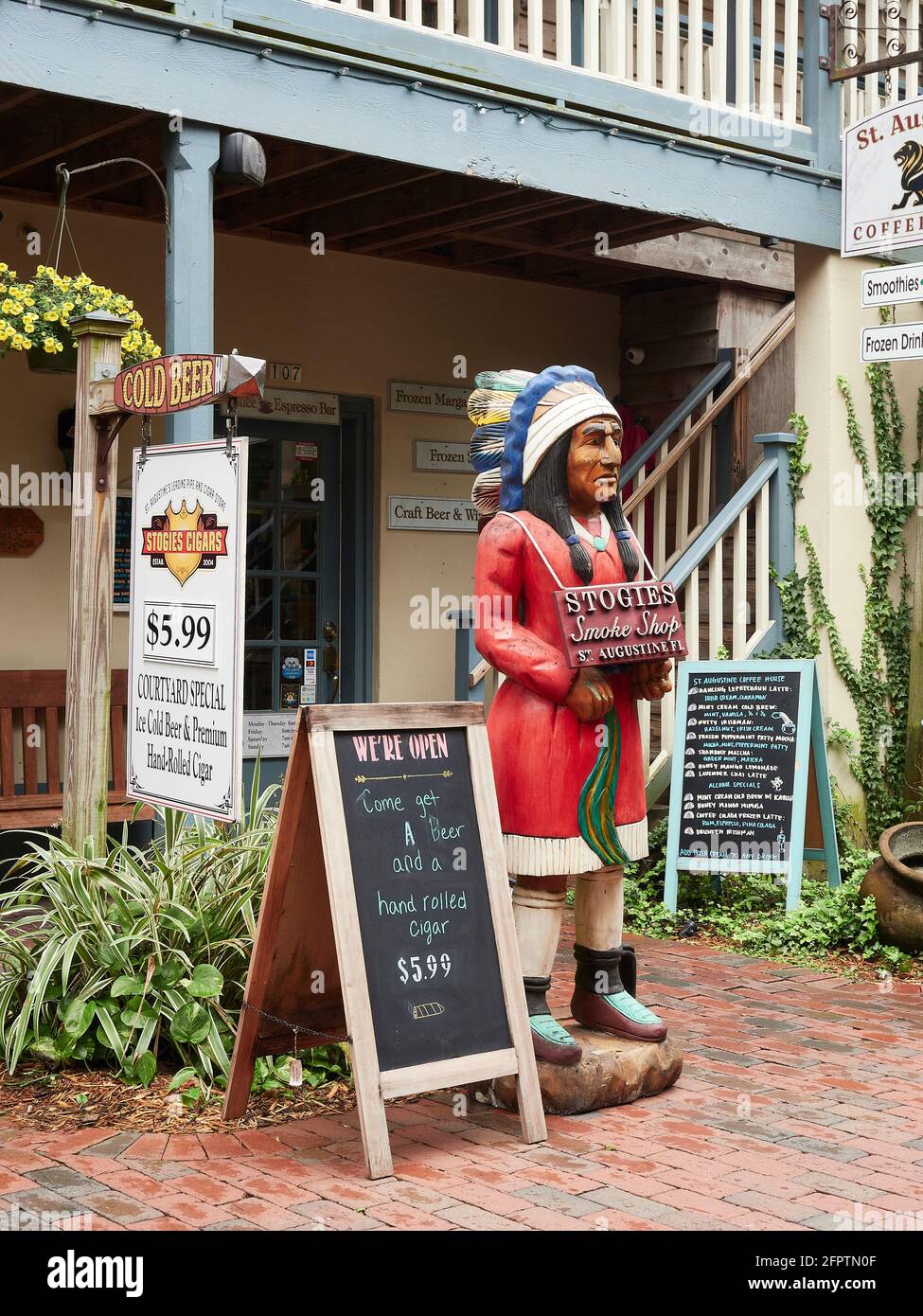 Cigar store indian or wooden indian stands in front of  a business in St Augustine Florida, USA. Stock Photo