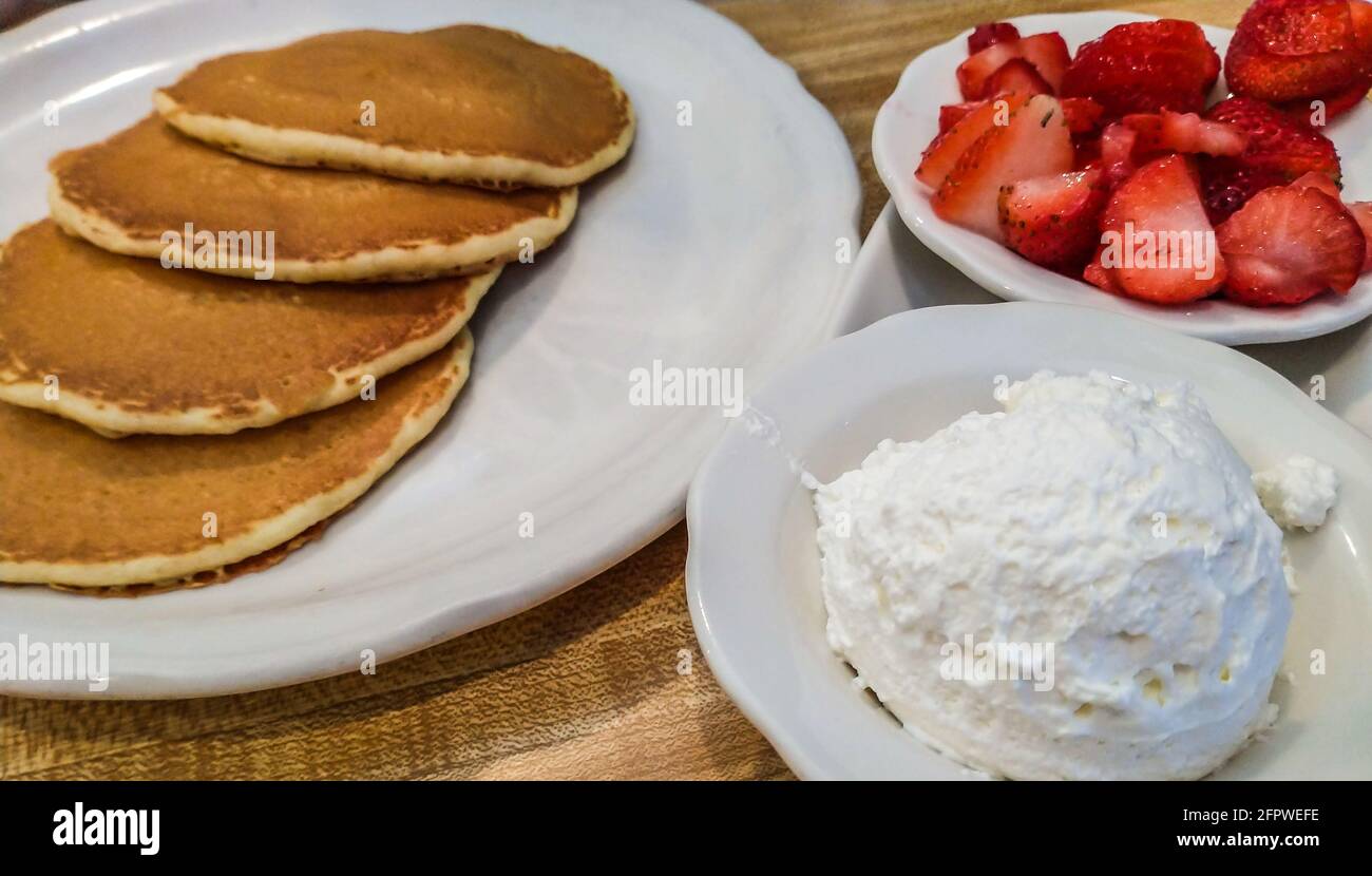 Whipped Cream with Pancakes and Strawberries Stock Photo Alamy