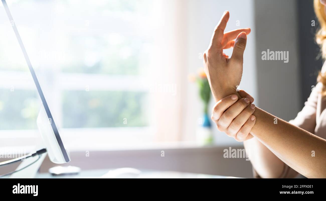 Young Woman With Pinched Nerve Pain At Office Desk Stock Photo Alamy