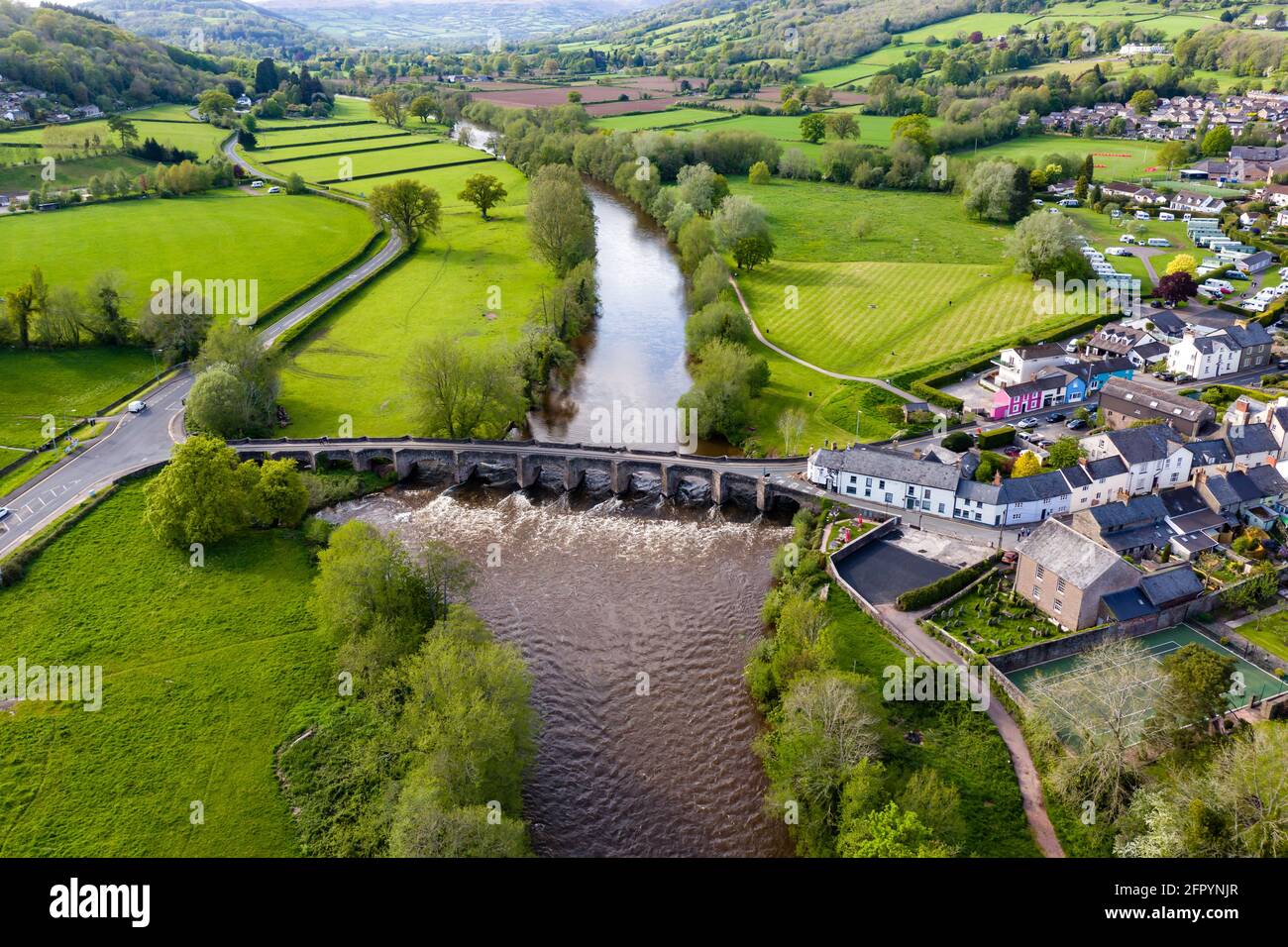 Aerial view of an old bridge across a fast flowing river (River Usk, Crickhowell, Wales) Stock Photo