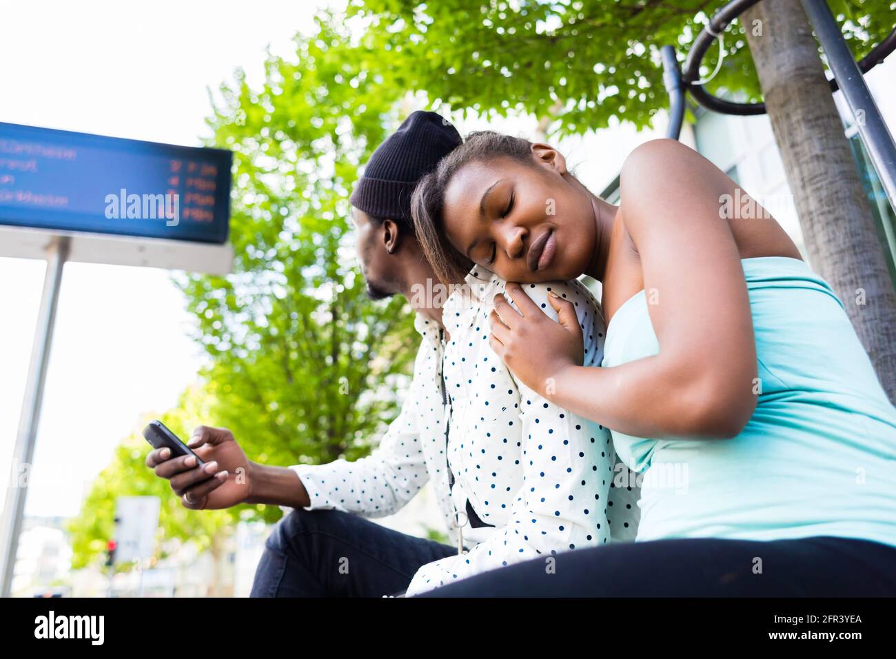 Black african woman waiting bus hi-res stock photography and images - Alamy