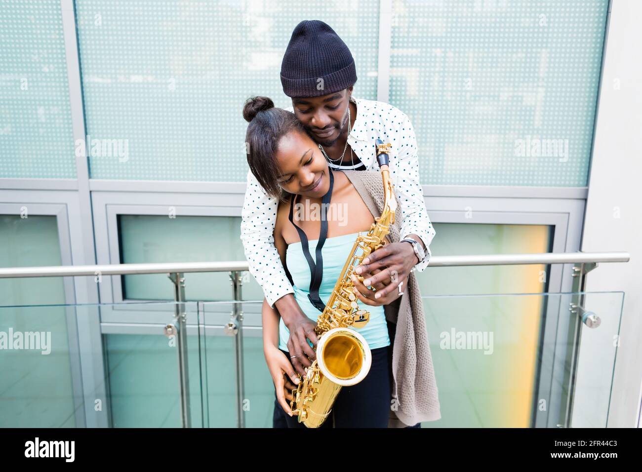 African couple playing Saxophone Stock Photo