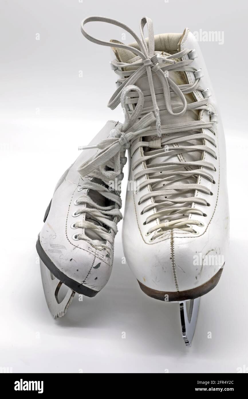 Big and small ice skating boots with laces on white background Stock Photo