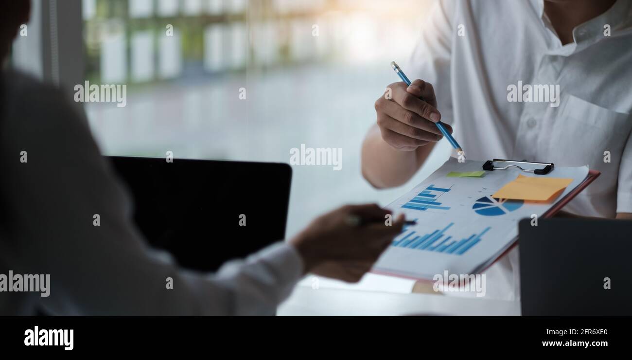 Fund managers team consultation and discuss about analysis Investment