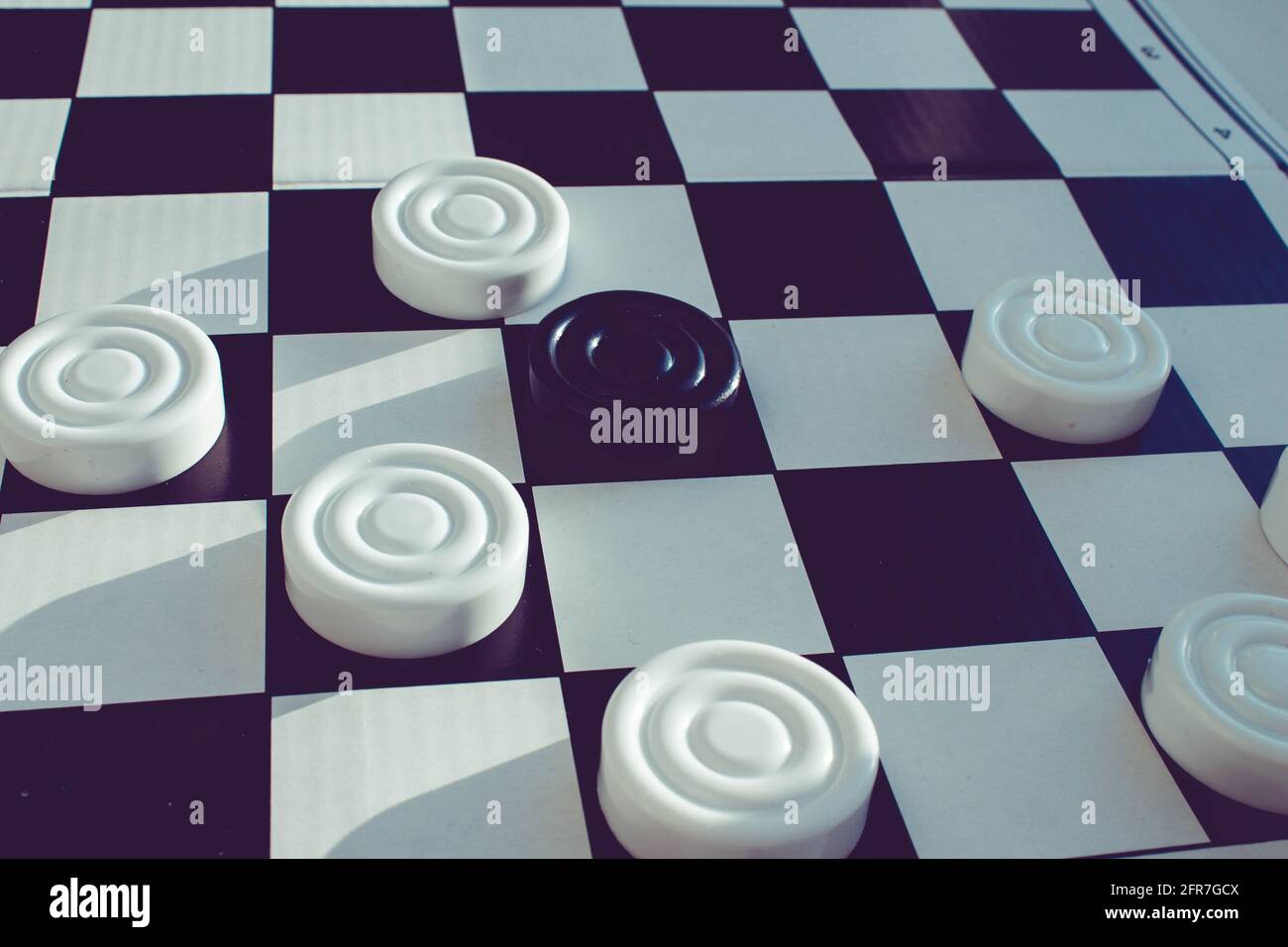 Board game of checkers. Black and white chips for the game. Chess field ...