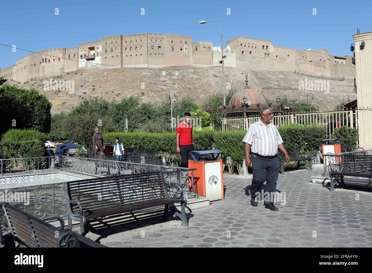 Erbil. 20th May, 2021. Photo taken on May 20, 2021 shows the general view of the Citadel of Erbil in downtown Erbil, Iraq. The ancient Citadel of Erbil, capital of Iraq's semi-autonomous region of Kurdistan, witnesses daily visits of hundreds of people, including foreign tourists, after the regional health authorities lifted the full curfew before the Eid al-Fitr holiday. Credit: Khalil Dawood/Xinhua/Alamy Live News Stock Photo