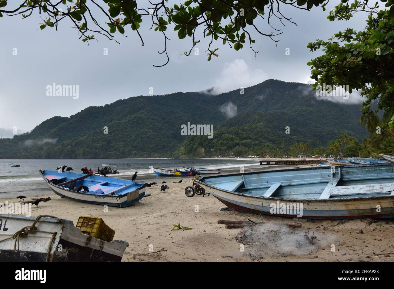 Fishing boats on the shore of the Maracas bay fishing village Stock