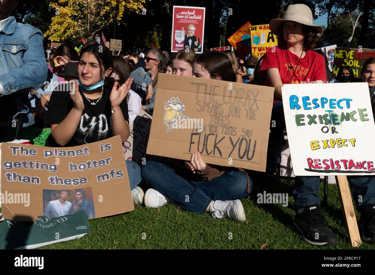 Melbourne, Australia 21 May 2021, School students hold protest sigs during a rally that brought 1000s of school students and supporters to the streets  of Melbourne for the 'Schools Strike 4 Climate' protests that called on governments around the world to take action on Climate change. Credit: Michael Currie/Alamy Live News Stock Photo