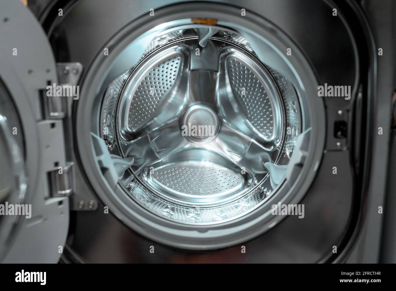 Washing machine laundry home appliance closeup of inside drum Stock Photo