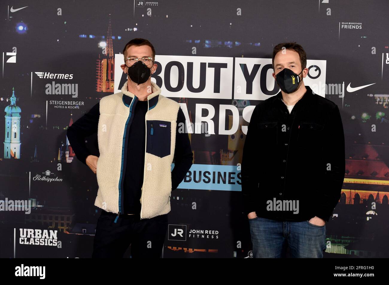 Munich, Germany. 20th May, 2021. Joko Winterscheidt (l) and Philipp Westermeyer show off at the 'About You' awards ceremony. The social media personalities of the year are honored in the categories Style, Sports, Business, Empowerment and Digital Art. Credit: Felix Hörhager/dpa/Alamy Live News Stock Photo