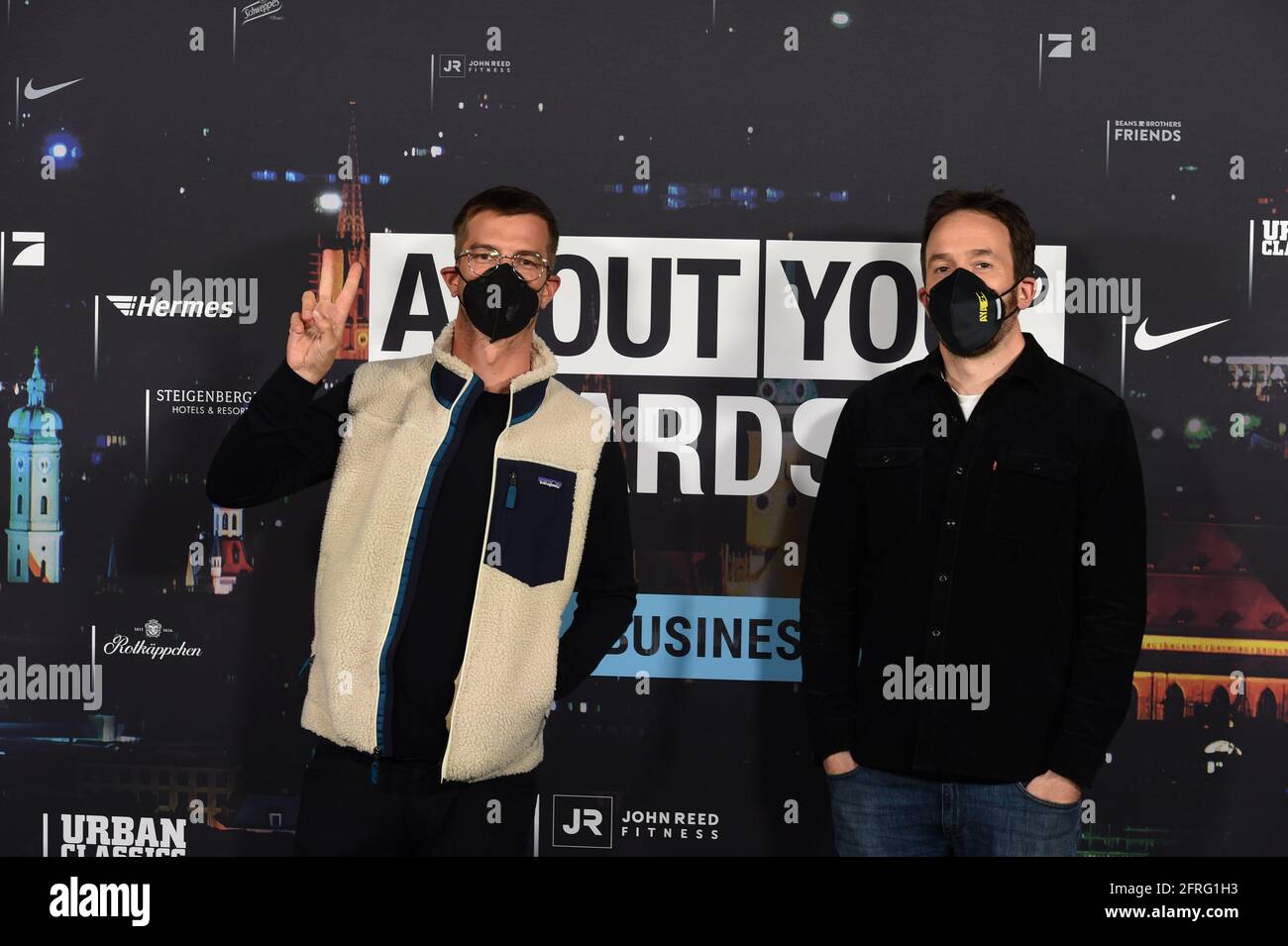 Munich, Germany. 20th May, 2021. Joko Winterscheidt (l) and Philipp Westermeyer show off at the 'About You' awards ceremony. The social media personalities of the year are honored in the categories Style, Sports, Business, Empowerment and Digital Art. Credit: Felix Hörhager/dpa/Alamy Live News Stock Photo
