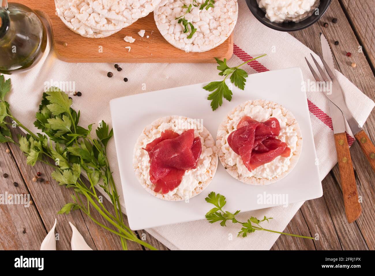 Rice cakes with milk flakes and cold beef Stock Photo - Alamy