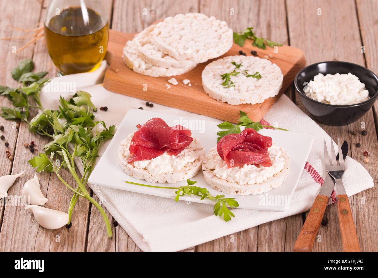 Rice cakes with milk flakes and cold beef Stock Photo - Alamy