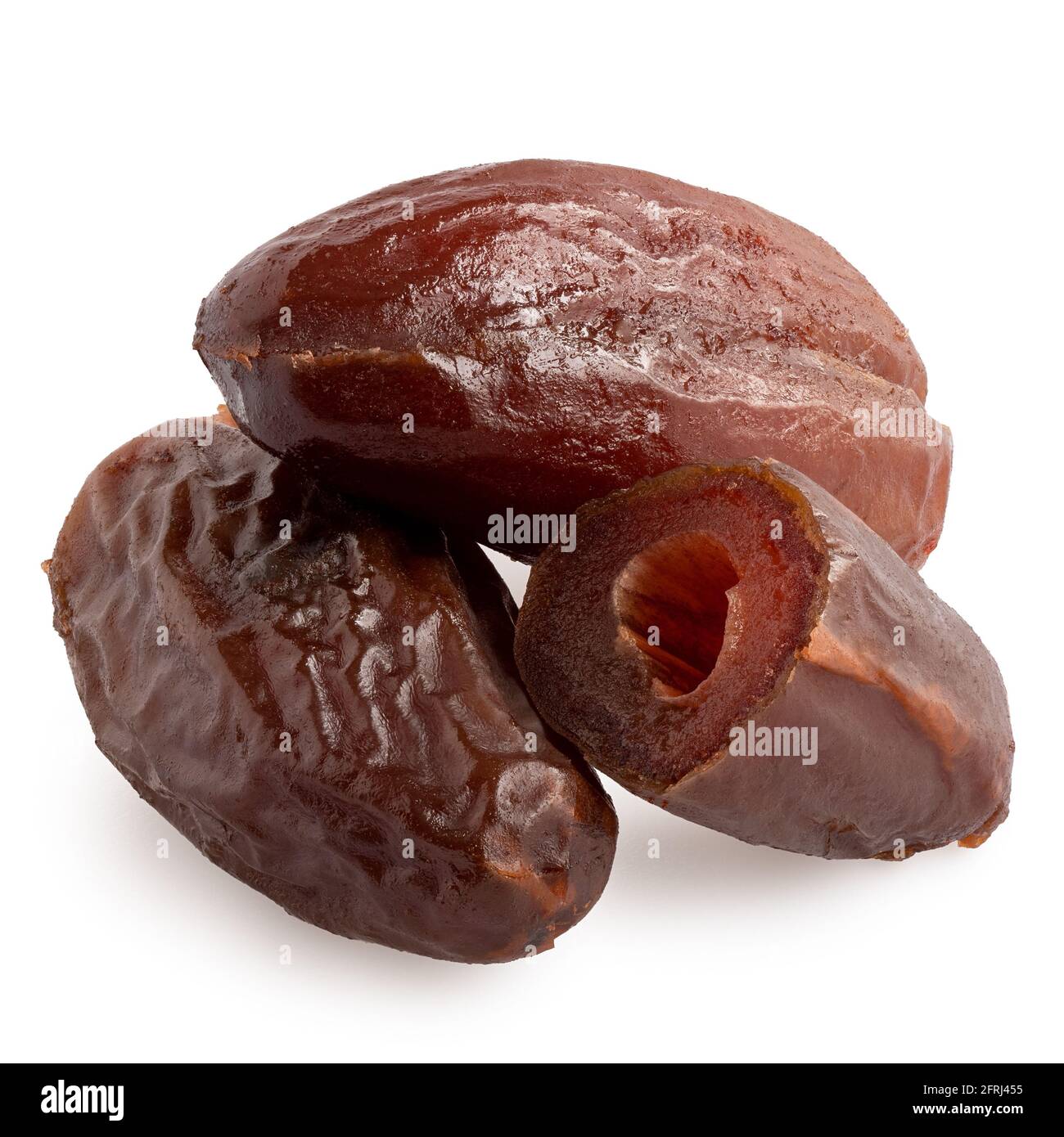 Two and half dry pitted dates isolated on white. Stock Photo