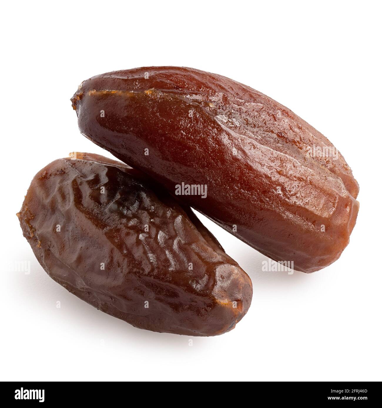 Two dry pitted dates isolated on white. Stock Photo