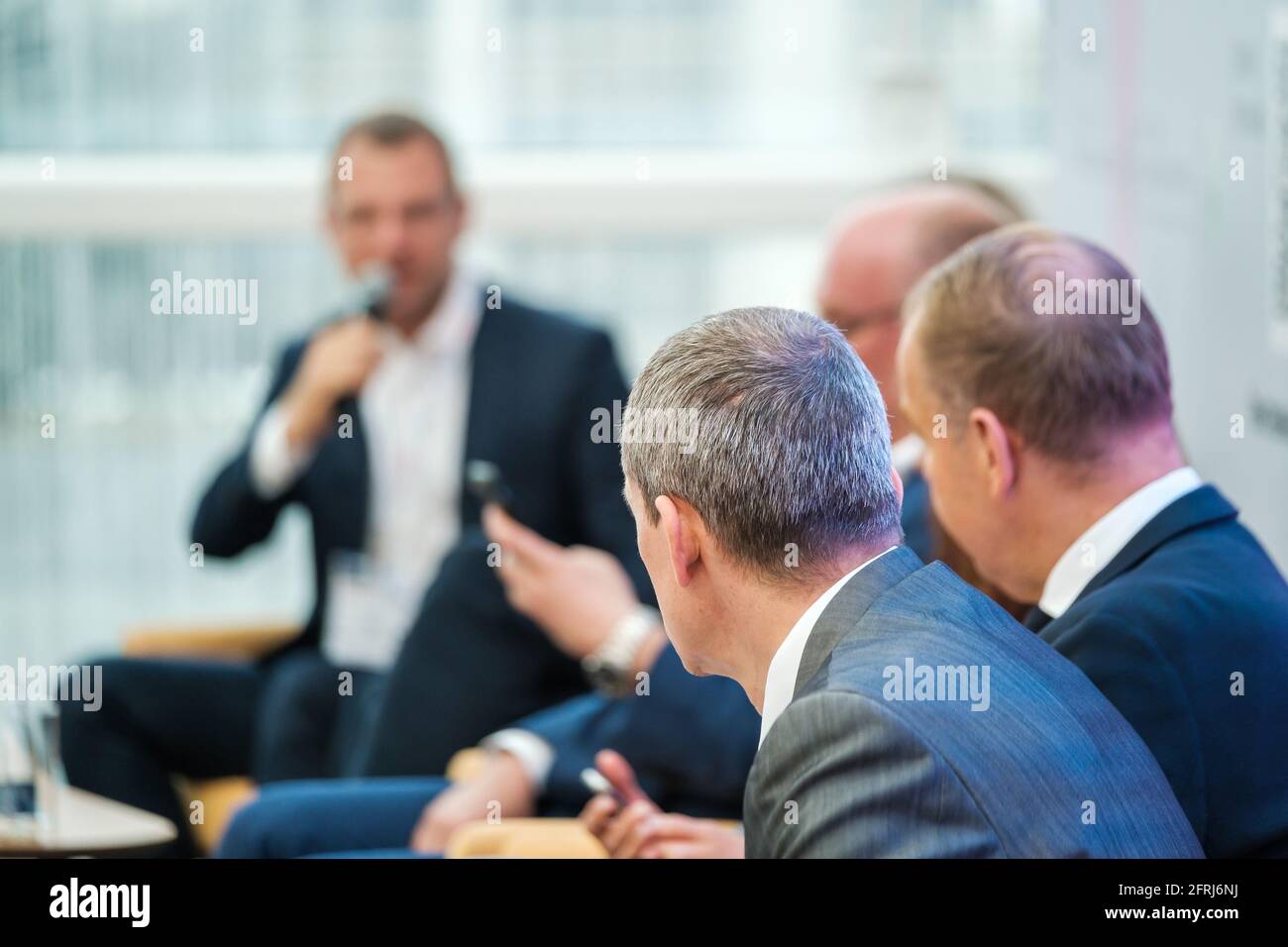 Businessmen discussing ideas during conference Stock Photo