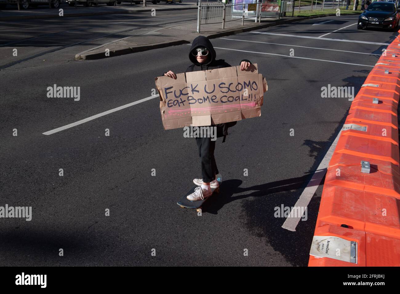 Melbourne, Australia 21 May 2021, A young protester on a skate board during a rally that brought 1000s of school students and supporters to the streets  of Melbourne for the 'Schools Strike 4 Climate' protests that called on governments around the world to take action on Climate change. Credit: Michael Currie/Alamy Live News Stock Photo