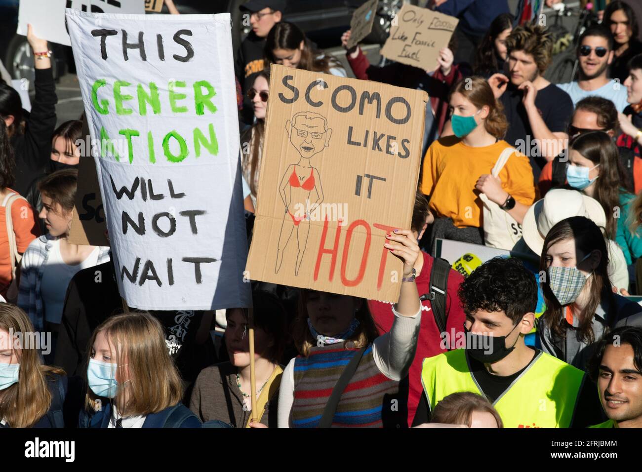 Melbourne, Australia 21 May 2021, A protester holds a sign parodying Prime Minister Scott Morrison during a rally that brought 1000s of school students and supporters to the streets  of Melbourne for the 'Schools Strike 4 Climate' protests that called on governments around the world to take action on Climate change. Credit: Michael Currie/Alamy Live News Stock Photo