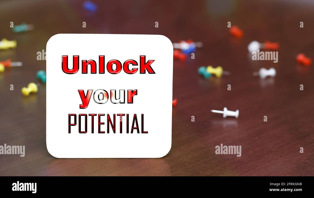 UNLOCK YOUR POTENTIAL a card with message. Motivational Inspirational Quotes Stock Photo