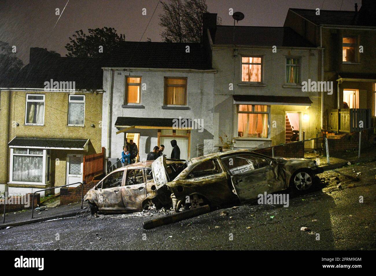 The aftermath of a riot in the Mayhill area of Swansea, which saw police attacked and several cars in the area torched during large scale disorder on the council estate. It is believed locals reacted when police turned up to a memorial that was taking place for a local man who had recently died. Stock Photo