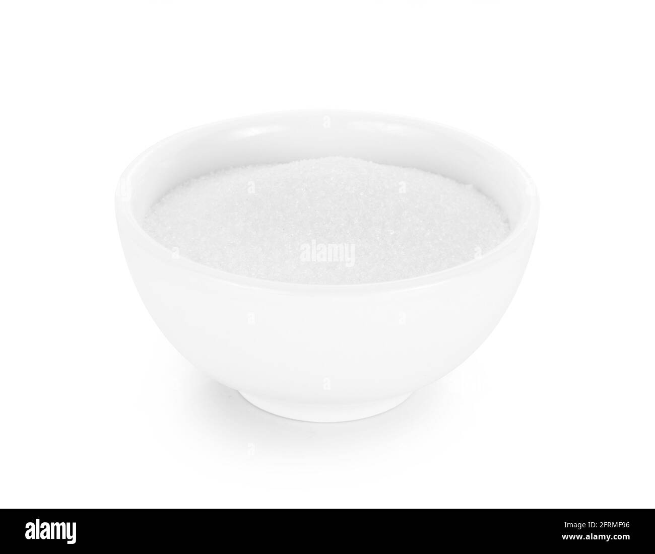 sugar in white bowl isolated on white background. Stock Photo