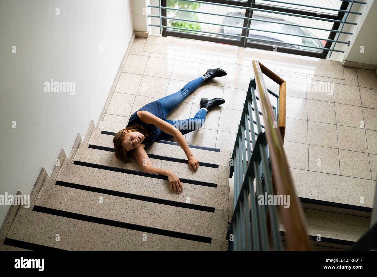 Slip And Fall Accident On Stairs. Worker Woman Fallen Down Stock Photo -  Alamy