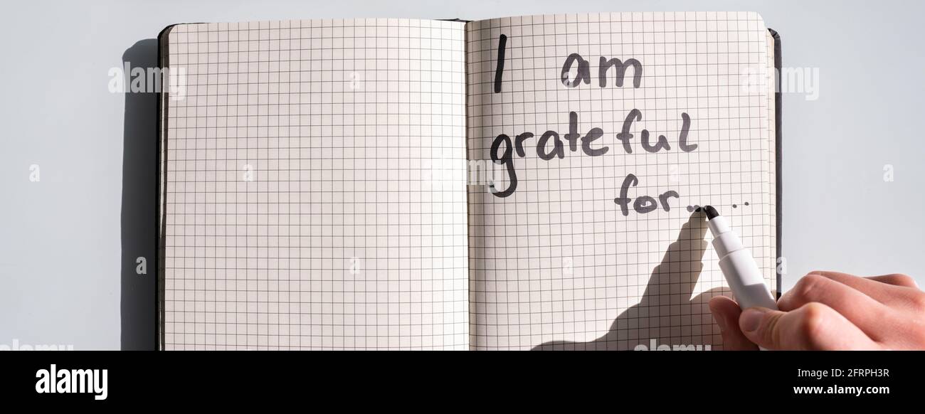 Gratitude Journal Concept. Writing I Am Grateful In Journal Stock Photo