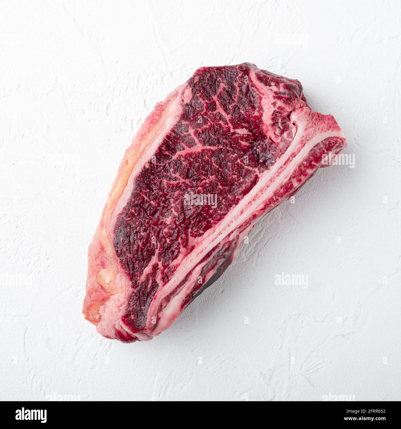 Beef on bone steak on white background Stock Photo Alamy