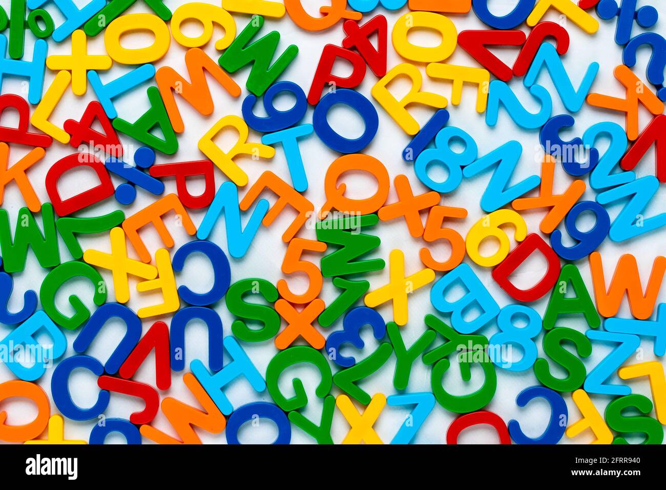 Alphabet, multicolor background with plastic numbers and letters. ABC. Education concept. Colorful abstract texture with signs. Knowledge symbol. Colo Stock Photo