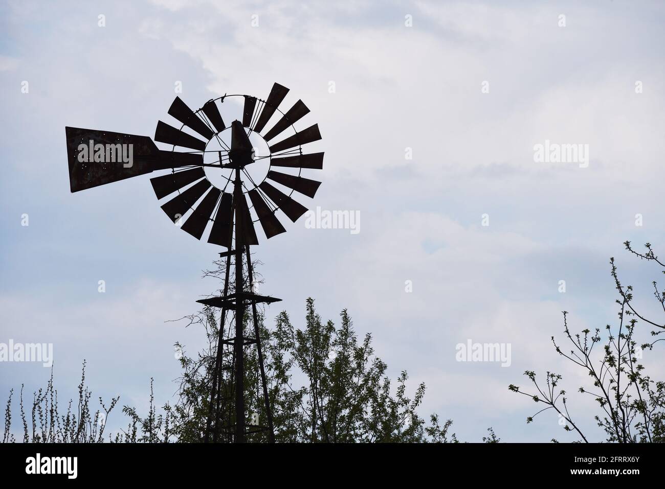 Old farm windmill for pumping water Stock Photo Alamy