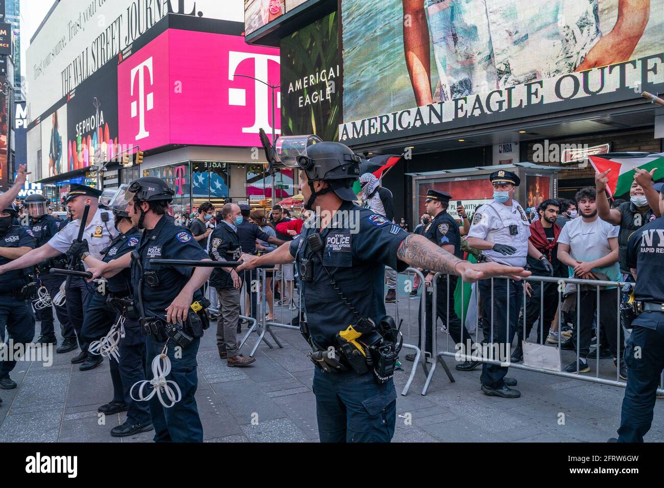 Pro-Israel and pro-Palestinian protesters clash with each other on Times  Square and adjusted streets. While the rally started peacefully protesters  from both sides quickly began to intimidate each other and soon fist
